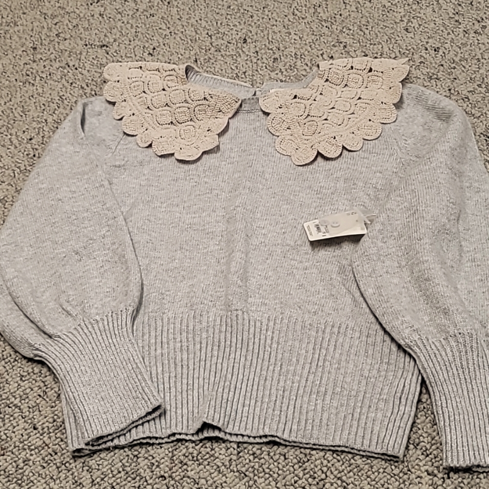 Ladies gray sweater.  This new piece displays a gorgeous beige collar.